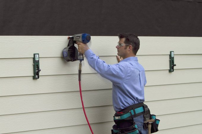 How do you install hardboard siding?